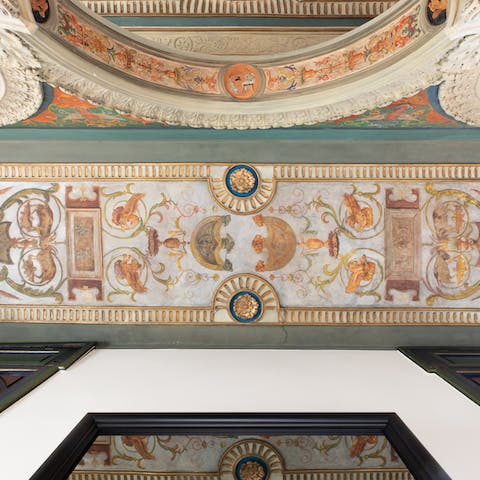 Admire the home's stunning ceiling frescoes