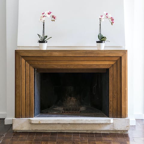 Take in the home's original wooden fireplace and exposed beams
