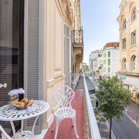 Start your day with breakfast out on the balcony, overlooking the elegant street below 