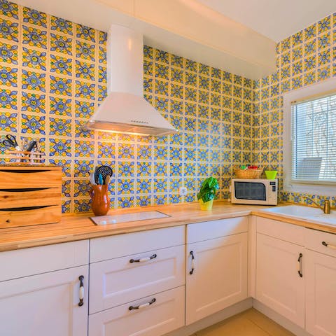 Admire the kitchen's cheerful tiles