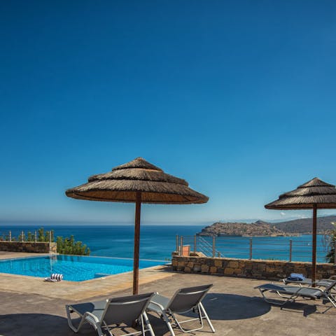 Relax by the private pool while you gaze out at the stunning sea views
