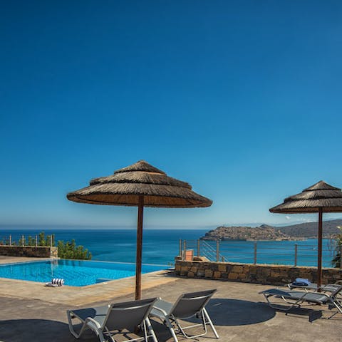 Relax by the private pool while you gaze out at the stunning sea views