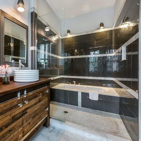 Treat yourself to a luxurious soak in the main bathroom's grand tub