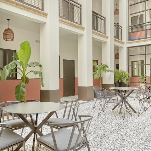 Mix your favourite cocktail to sip in the elegant courtyard