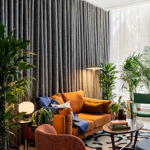 Stay in one of London's most prestigious buildings – the shared lounge is overflowing with greenery