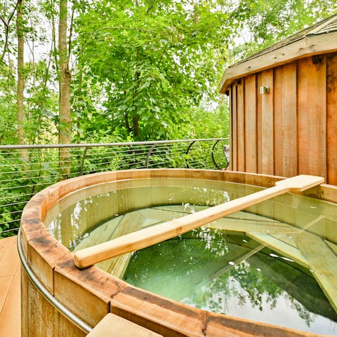 Soak in your wood-fired hot tub while delighting in your forest surroundings
