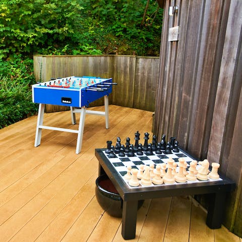 Challenge your loved ones to a game of chess or round of foosball in the games area