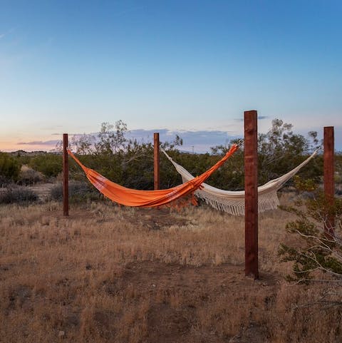 Watch the setting sun from the gently swaying hammocks