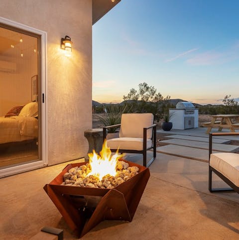 Light up the fire pit to ward off the desert chill