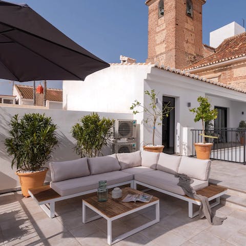 Relax with a cup of coffee on the sunny terrace