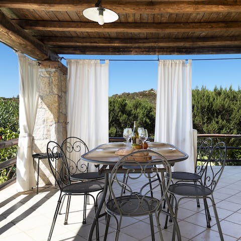 Dine alfresco on the veranda, enjoying Sardinian dishes