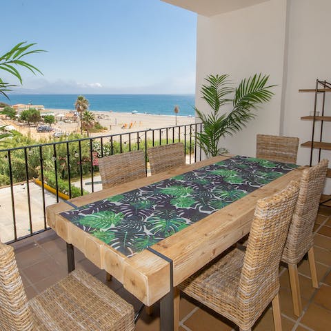 Enjoy sunset drinks and al fresco dining on the balcony
