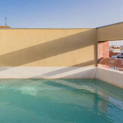 Slip into the cooling waters of the communal rooftop pool