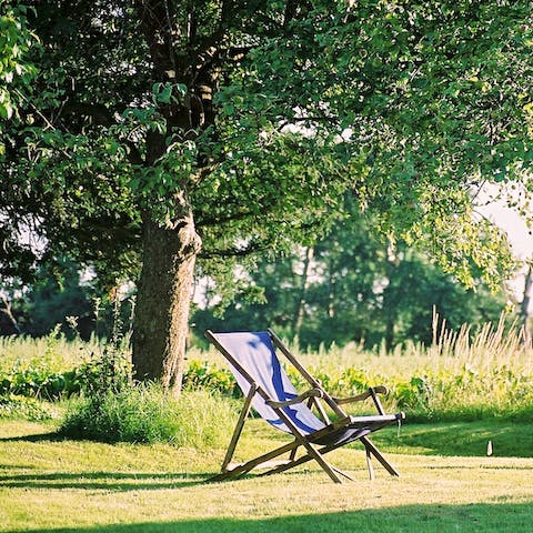 Laze under the orchard's apple and pear trees 
