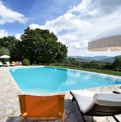 Sit back and relax by the pool with stunning views