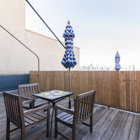 Unwind on your private terrace with skyline views over the city