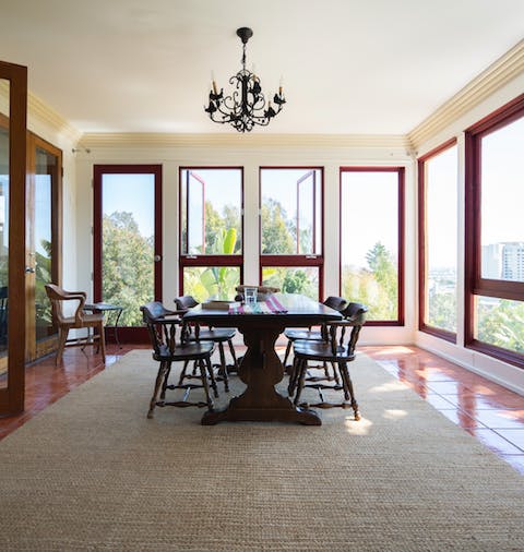Take in the leafy green views from the beautifully luminous dining room