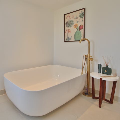 Treat yourself to a long soak in the large freestanding bathtub