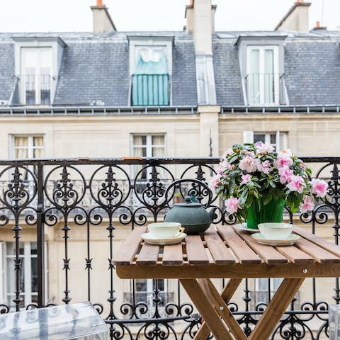 Embrace timeless French charm with tea on the balcony 