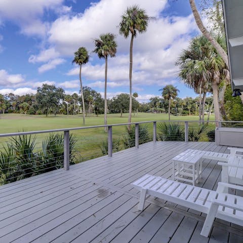 Take in the scenes of the fairway on the deck, complete with lounge chairs and sunset views