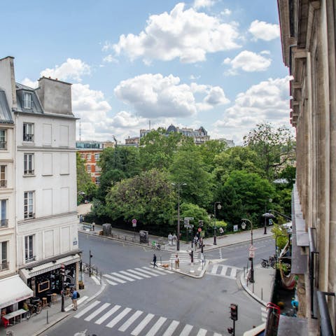 Watch the hustle and bustle below from this third-floor apartment