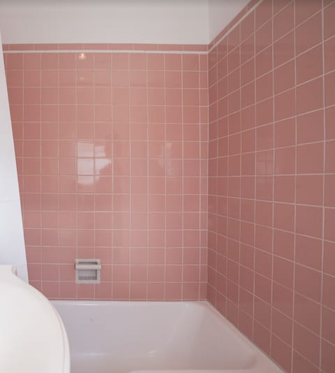 the pink tiles in the bathroom