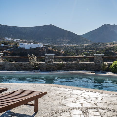 Sunbathe surrounded by dramatic mountain views