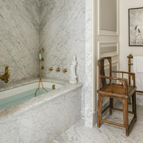 Treat yourself to a soak in the marble tub after a day of Paris sightseeing