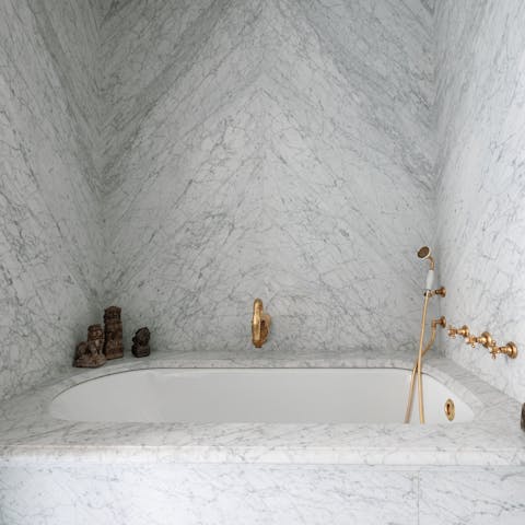 Treat yourself to a soak in the marble tub after a day of Paris sightseeing