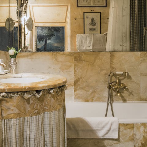 Pamper yourself like a king or queen in the stunning marble bathroom