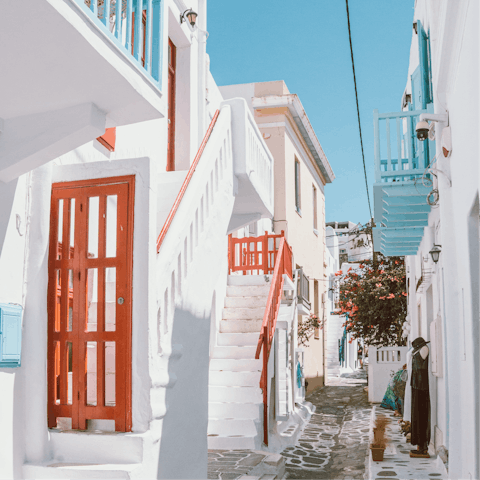 Experience the vibrant nightlife of Mykonos Town – it's a short drive away