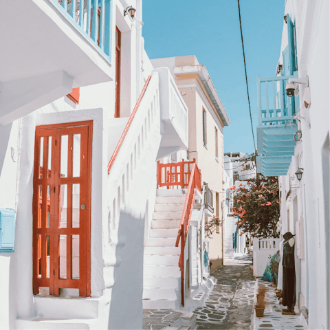 Experience the vibrant nightlife of Mykonos Town – it's a short drive away