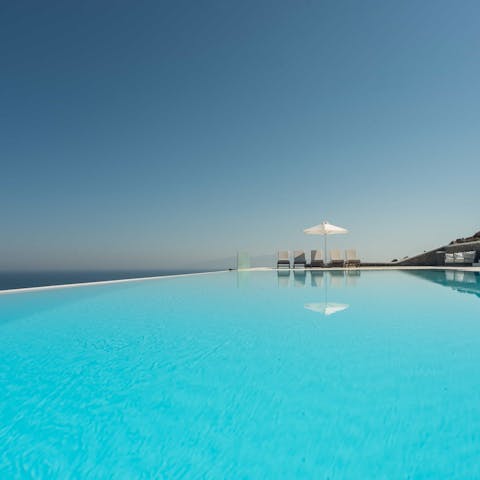 Float in the private infinity pool or sunbathe alongside it