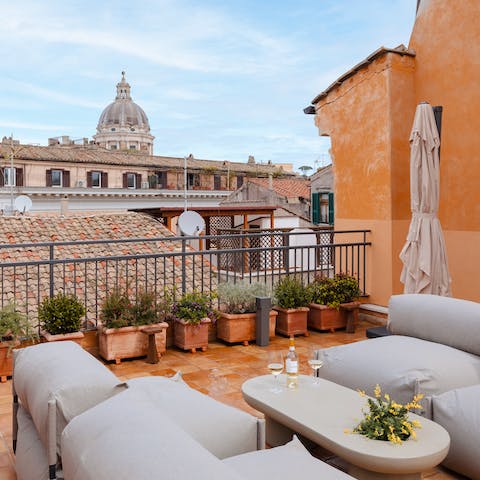 Relax on the communal terrace while enjoying the rooftop views