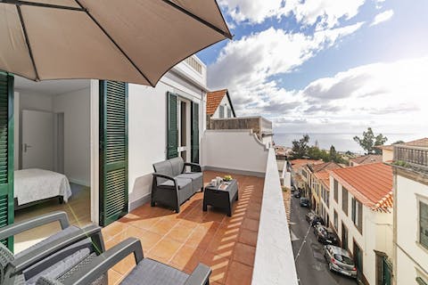 Soak up the sun or catch up on some reading on this lovely balcony with sea view