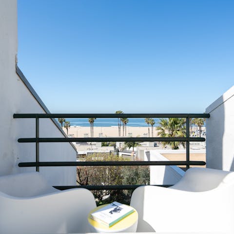 Relax on your sunny private terrace just moments from the beach