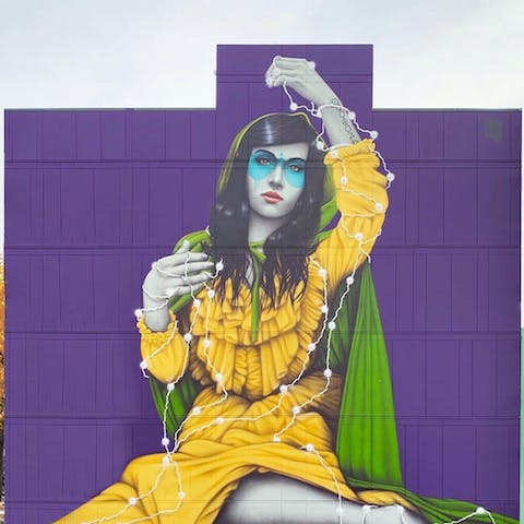 Admire the unique mural painted by artist Fin Dac