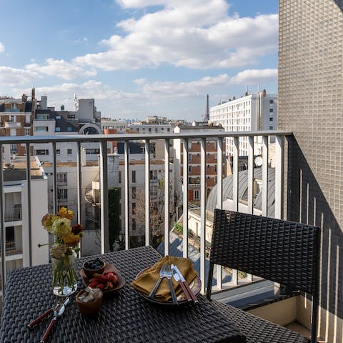 Take in views of the Eiffel Tower from your private balcony