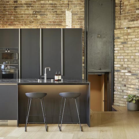 Start mornings off at the breakfast bar and admire the kitchen's original steel fire door