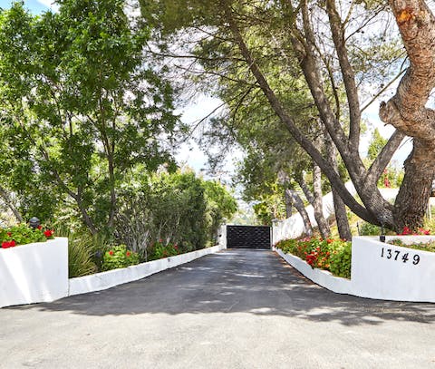 Pull up your gated home in one of LA's most famous and sought-after streets