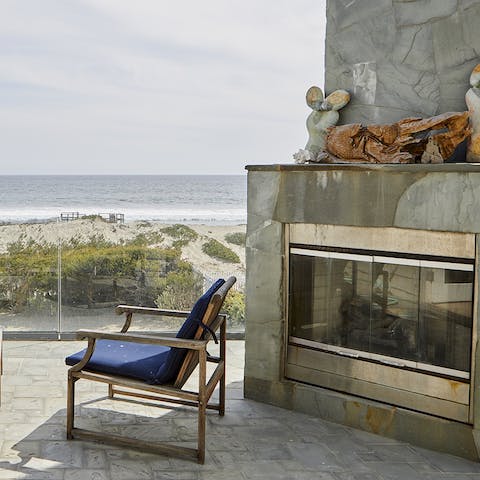 An outdoor fireplace with views of the ocean