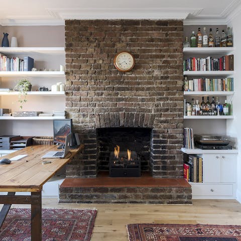The exposed brick fireplace