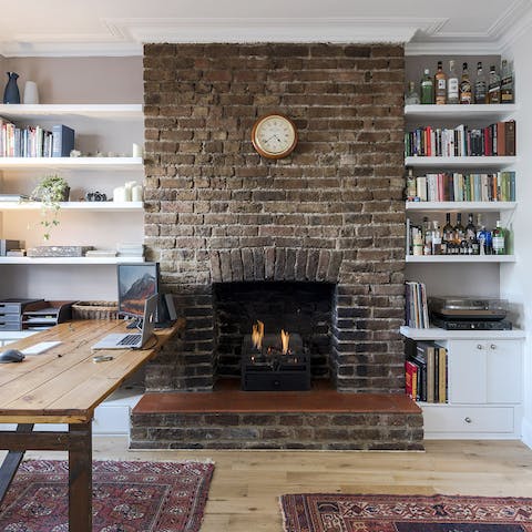 The exposed brick fireplace