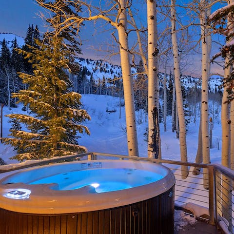 Treat yourself to a long soak in the home's private hot tub on the deck