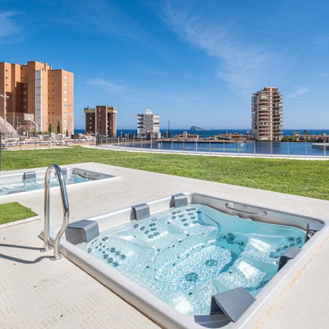 Soak in the hot tub while enjoying the view