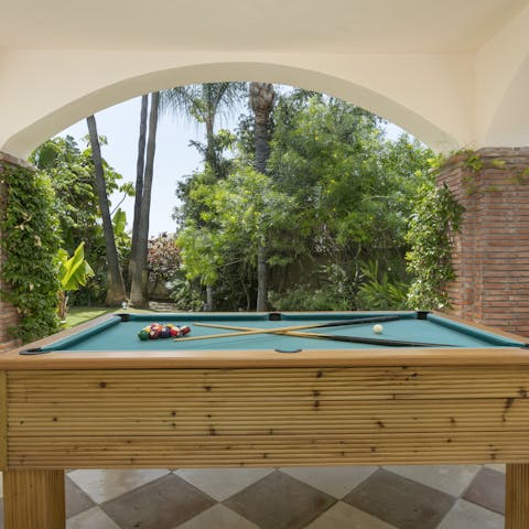 Challenge your loved ones to a pool tournament out on the sun-shaded patio