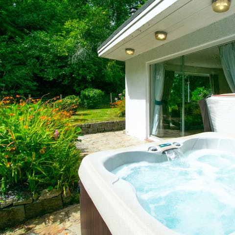 Enjoy a soak in the hot tub and watch the sunset