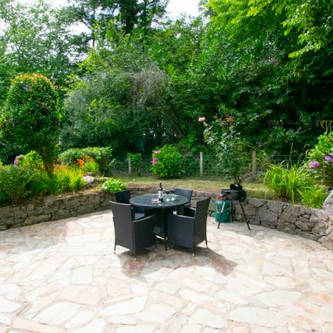 Fire up the barbecue and eat dinner among the flourishing plants in the garden