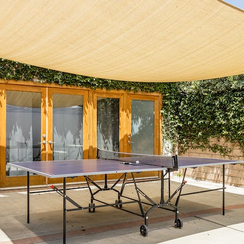 Get competitive over a game of ping pong in the garden
