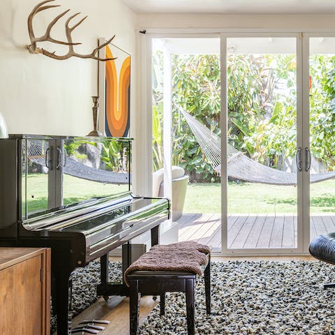 Try your hand at the piano overlooking the garden 
